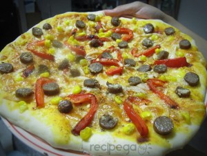 Pizza with beef sausage