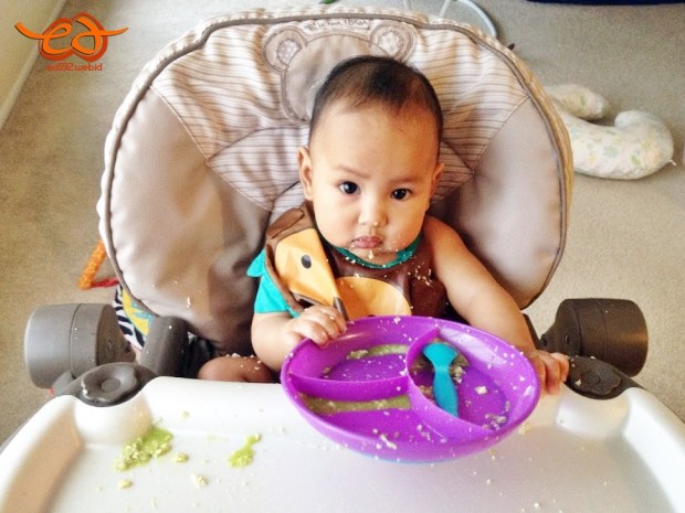 messy baby eating solid foods